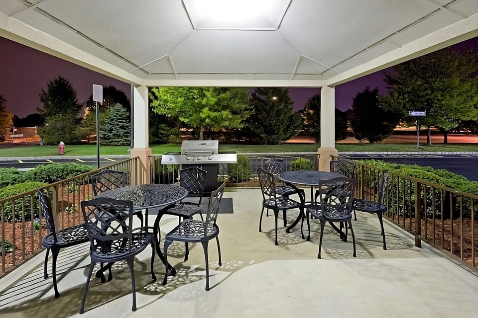 Sip and chat at shaded tables on the covered patio.
