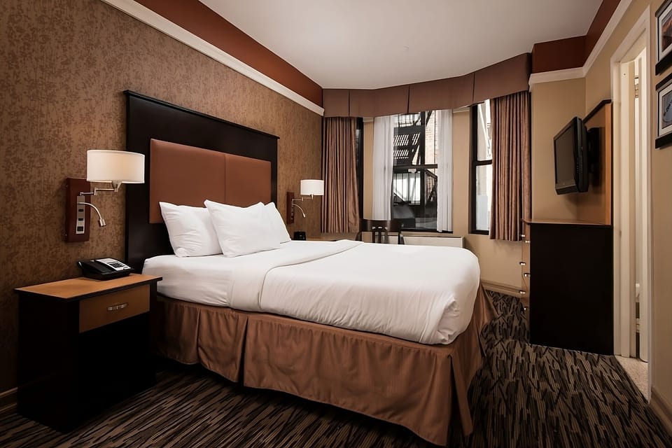 Recharge in a quiet corner room with calming, warm tones.
