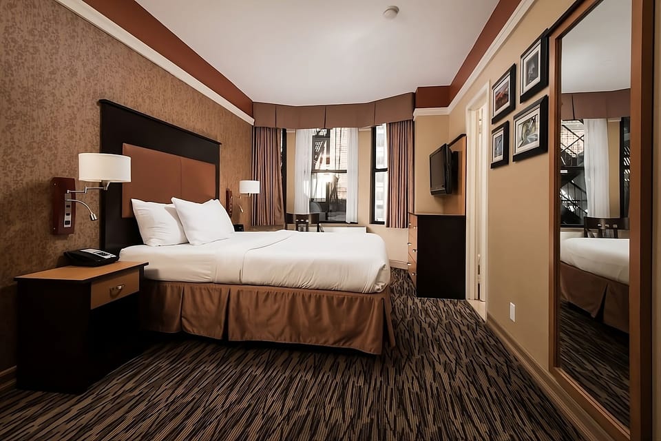 Relax in a spacious king room with thoughtful wall art.
