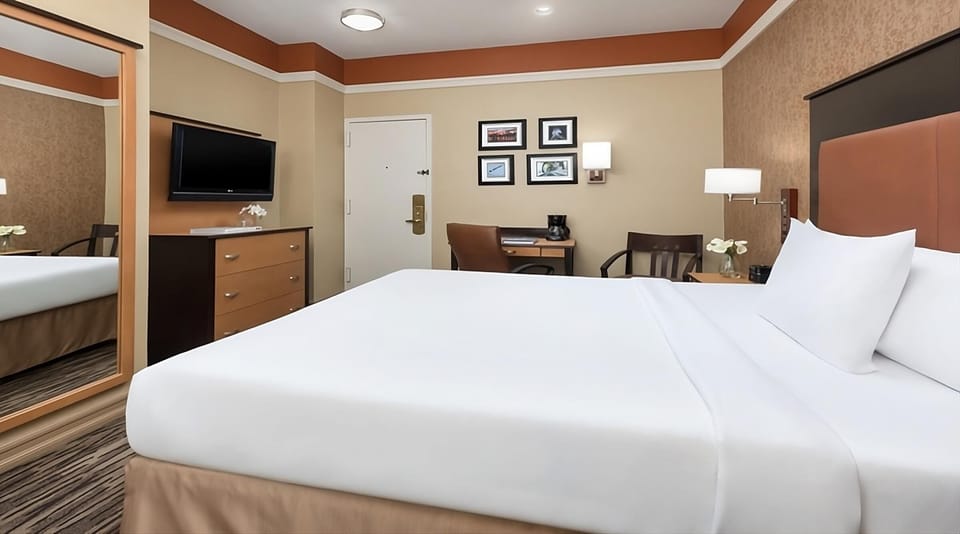 Get productive at the in-room desk, then sink into bed.