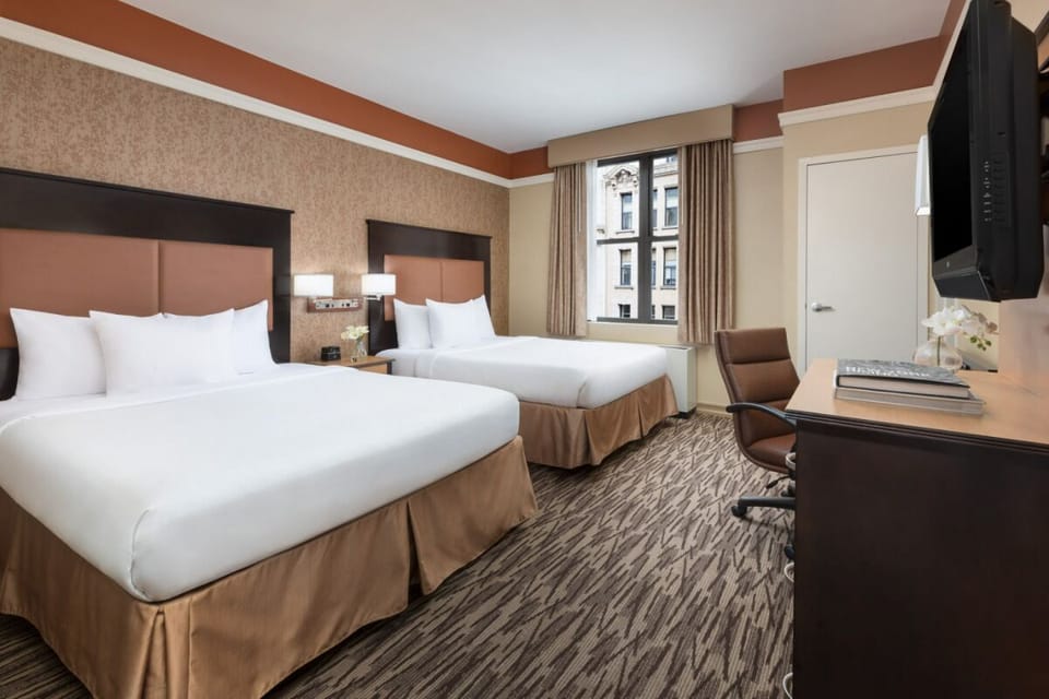 Settle in with roomy beds and a practical work desk.
