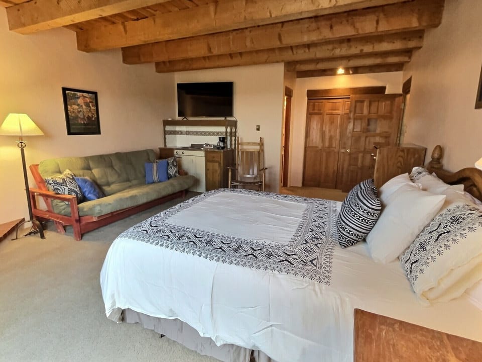 Top floor bedroom feels private and comfortable with futon and large Smart TV