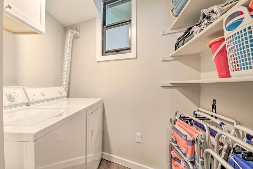 Laundry with beach chairs and beach toys.