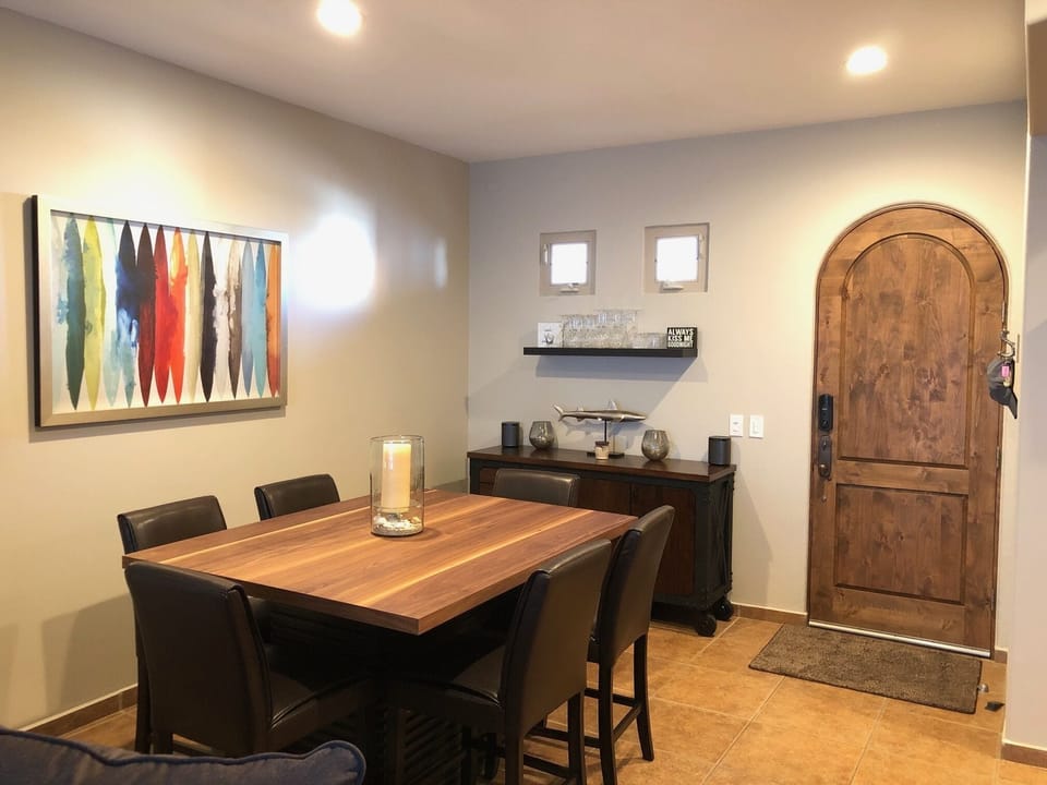Dining table, front entry door to the right