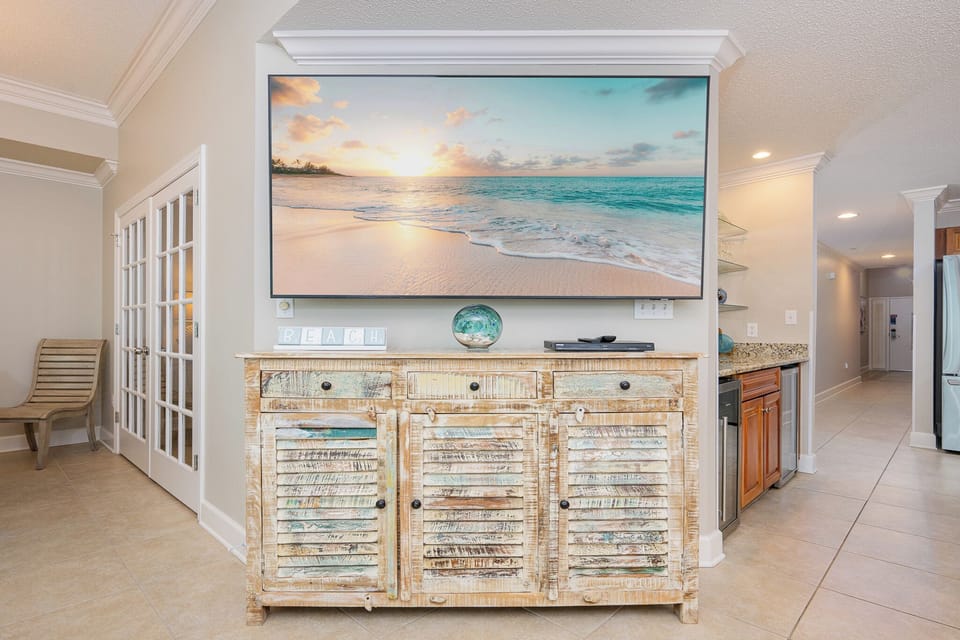 Unwind in the cozy seating as you enjoy your favorite shows while soaking in the beach vibes and decor