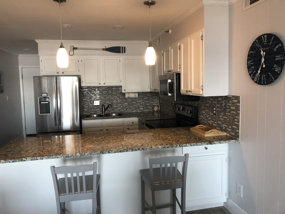 Fully equipped kitchen with many updates and optional bar eating