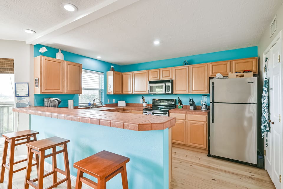Full kitchen with dishwasher, ice maker full-sized oven, and all the supplies 