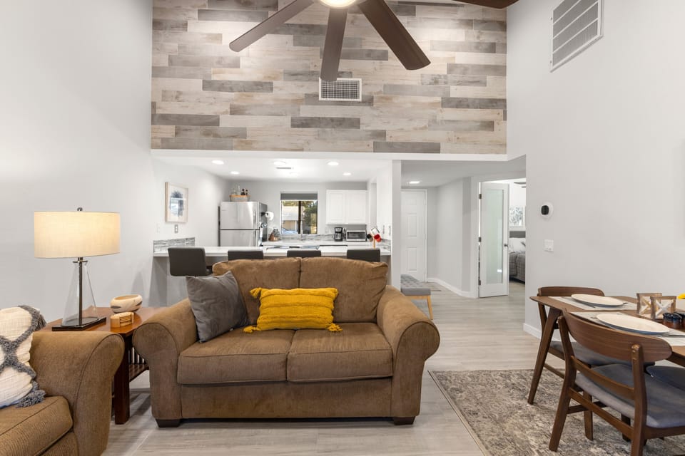 Tile wall and seating at quartz counter.