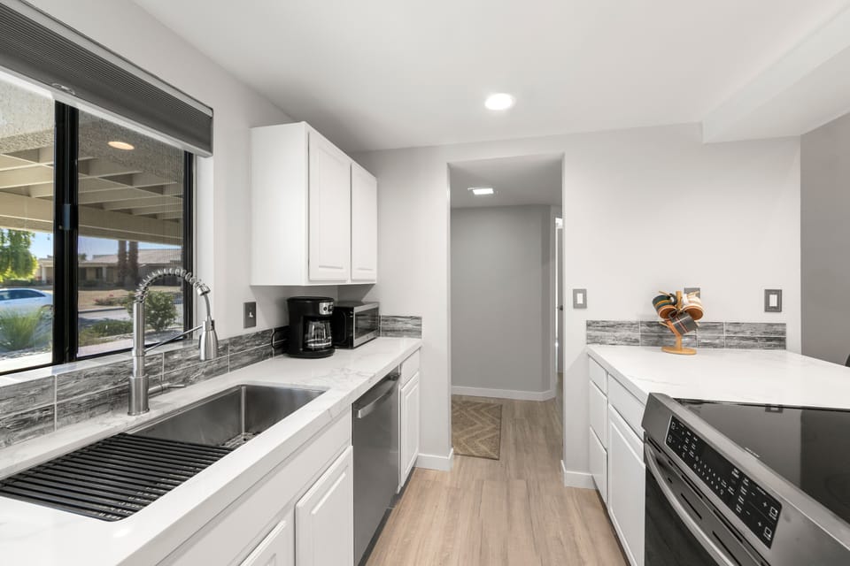 Quartz counter tops, stainless steel large sink, new dishwasher and frig. 