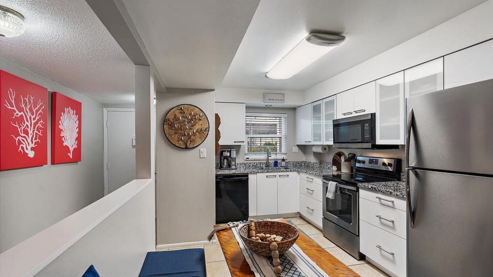 Kitchen Kitchen updated kitchen with granite, stainless steel appliances and white cabinets.
