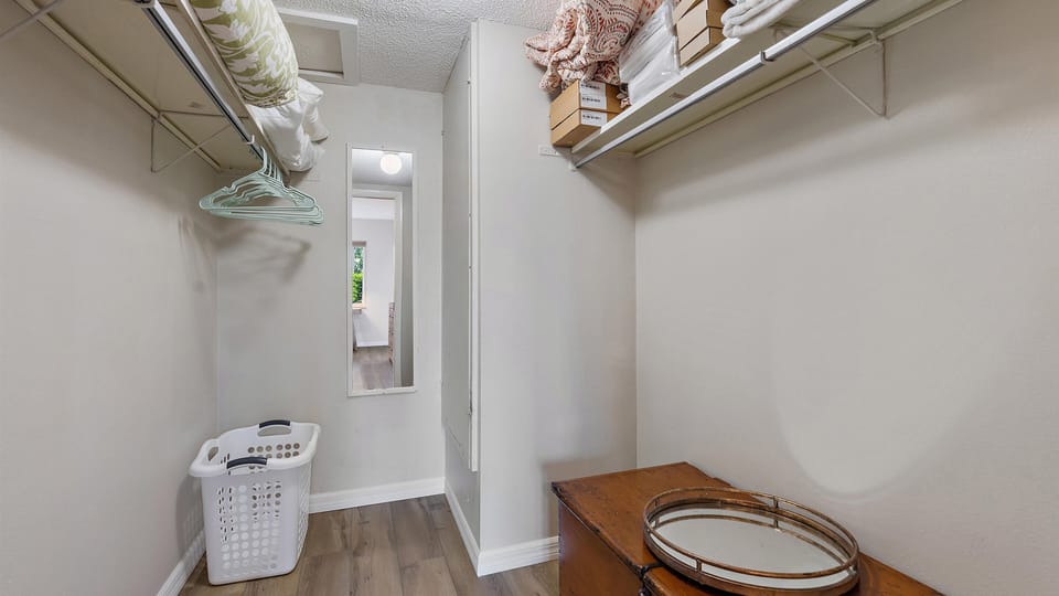 Primary Bedroom Closet Primary Bedroom Closet The primary suite has a walk-in closet for all your personals. 