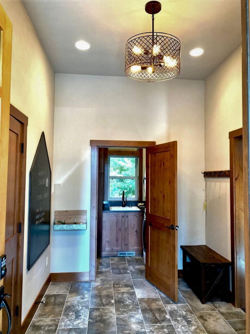 Entryway with laundry room and powder room