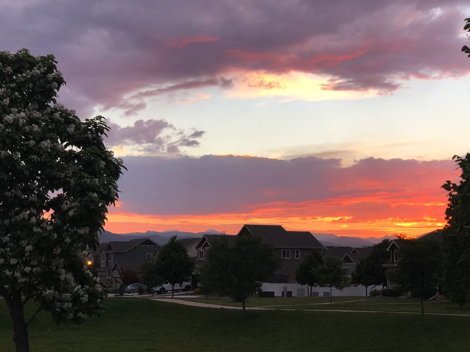 Sunset near end of street with walking path