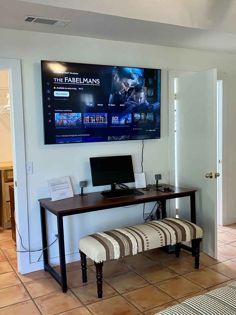 King Master desk, docking station and 65" TV
