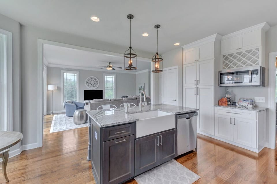 Large farmhouse sink with garbage disposal. Kitchen supplies are provided