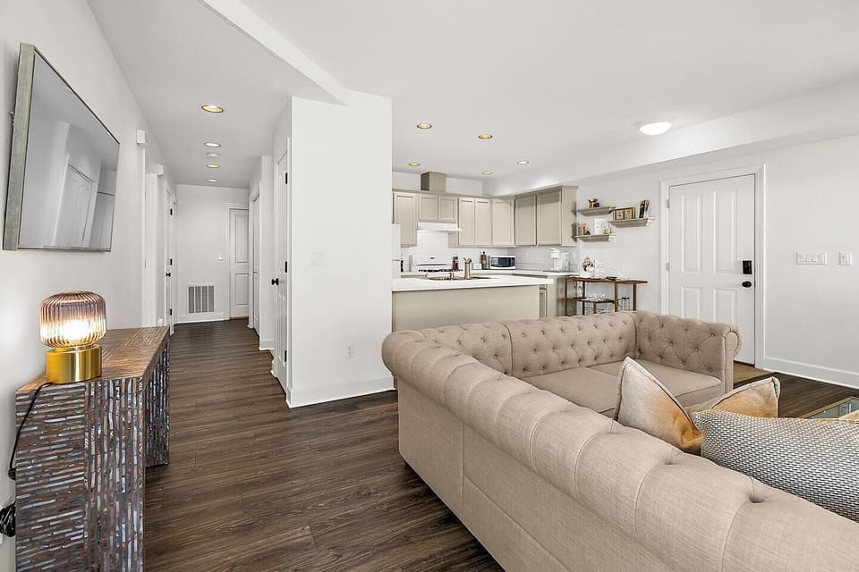 Hallway leads to bedrooms, baths and laundry