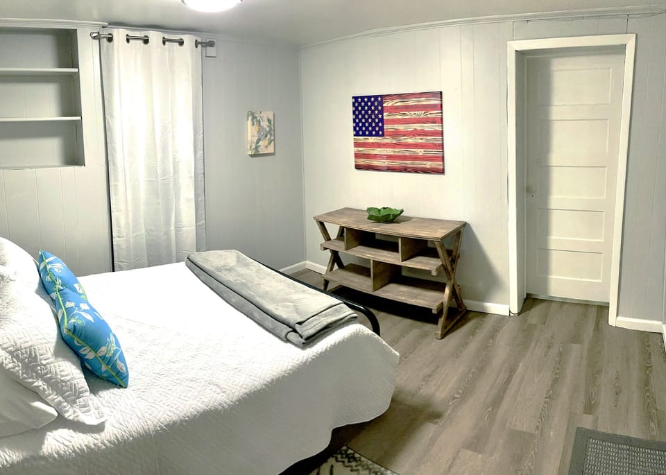 Second bedroom with double bed. Good size space with closet and shelving storage