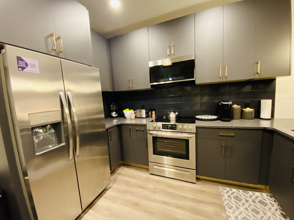 Kitchen with stainless steel appliances, coffee maker, toaster and blender