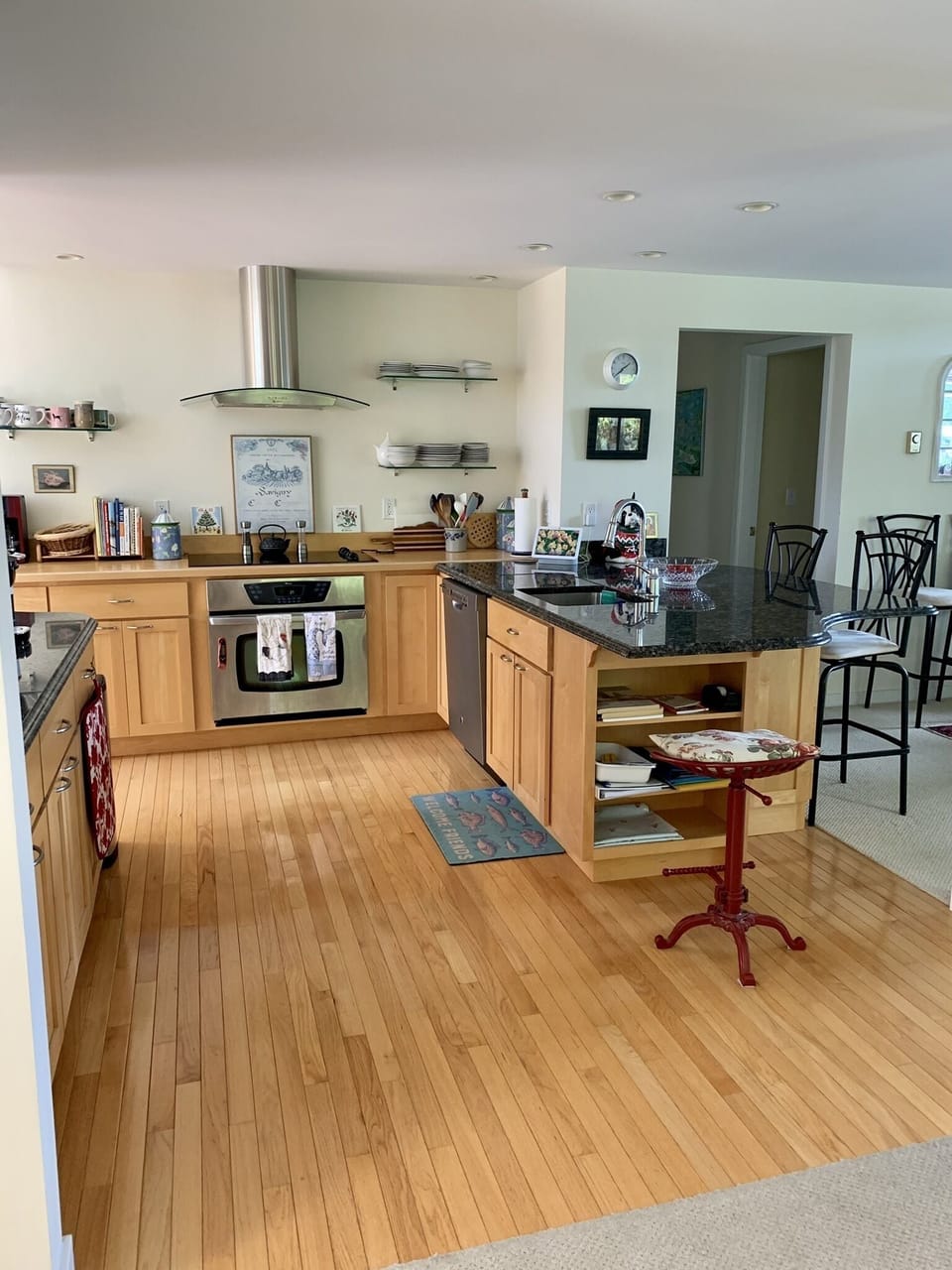 Kitchen with granite counter top and high top seating.
