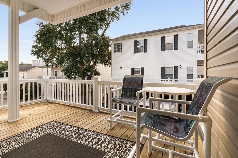 Sunny outdoor deck with cozy seating for relaxing gatherings