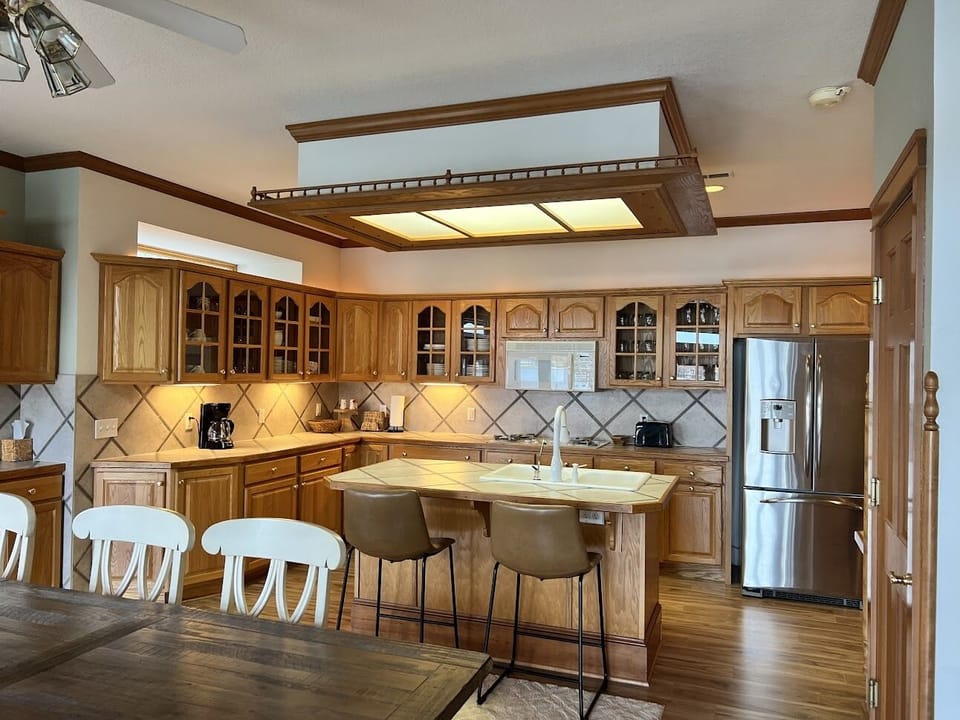 Enjoy meals at the counter seating 2 and the family sized table seating 10.