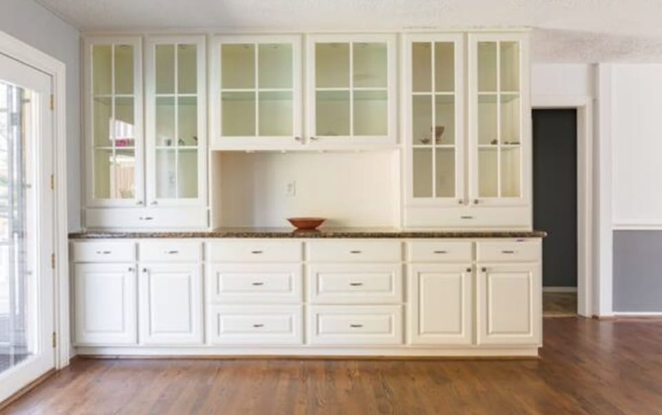 A beautiful cabinet shows off pretty souvenirs from all over the globe