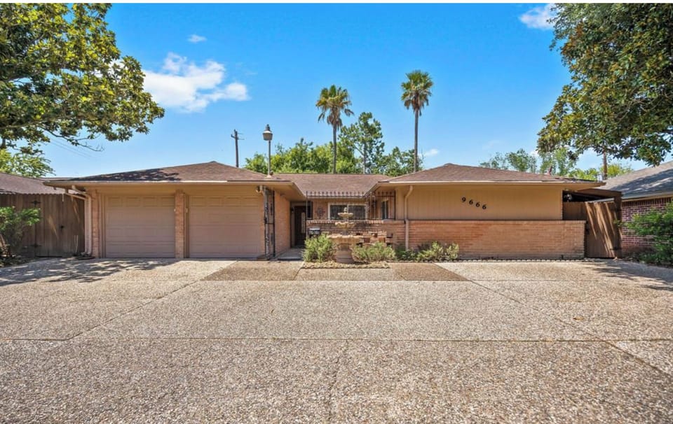 RESORT-LIKE home with a huge driveway.