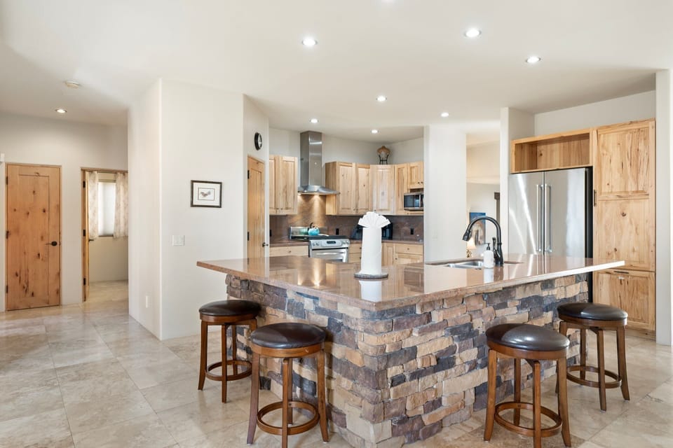 Barstool seating for 4 to overlook the kitchen.