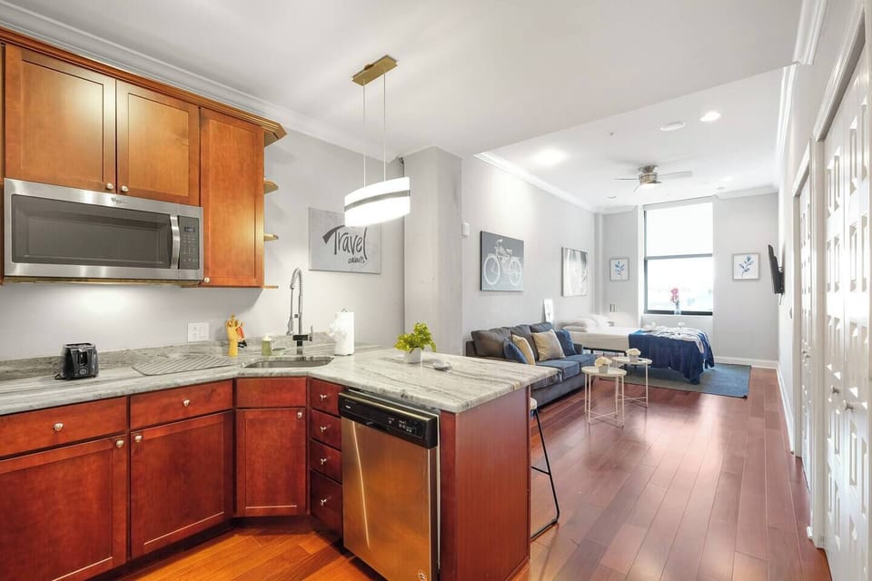Versatile dining space with modern table and seating for meals, remote work, or entertaining.