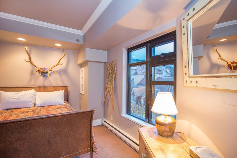 The master bedroom features a comfortable double bed
