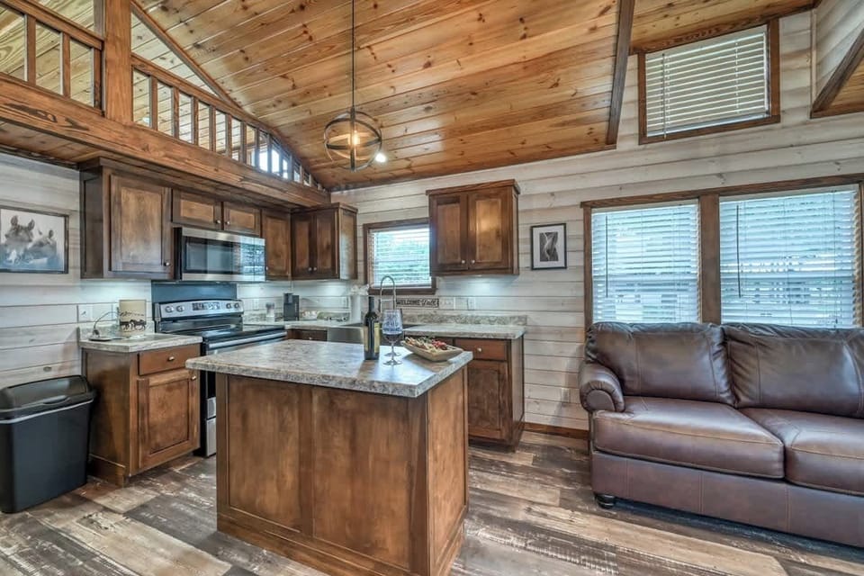 Enjoy a full kitchen and a large center island with your rental during your stay!