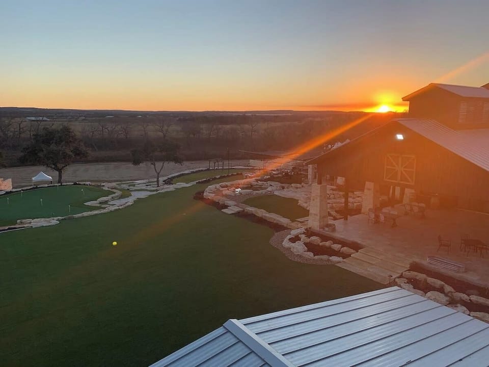 A stunning sunset photo from the wine members viewing tower overlooking the entire Resort Property, The Texas Hill Country in the Distance, and Pedernales River! You won't forget this stunning view during your sta