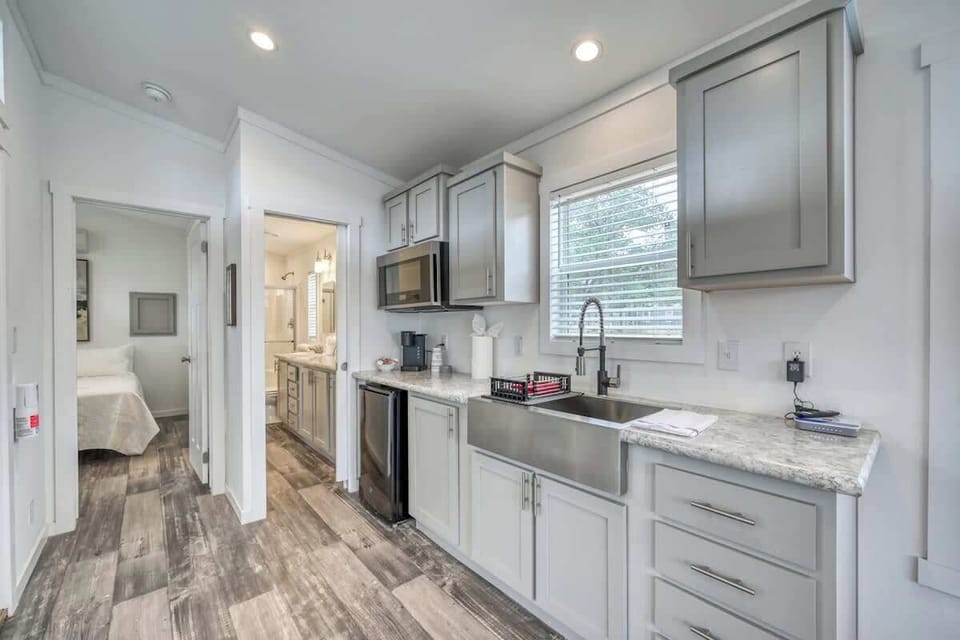 Convenient Kitchenette with a mini fridge, microwave, coffee pot and sink