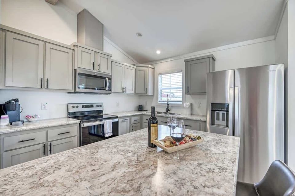 Enjoy a full kitchen and a large center island with your rental during your stay!