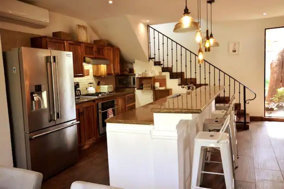 Upstairs is the primary bedroom with ensuite bath and terrace