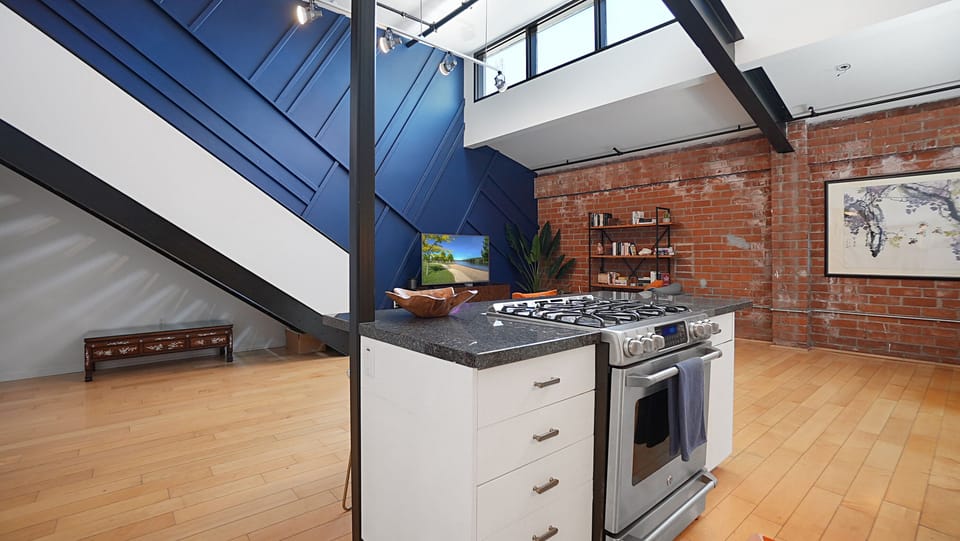 The kitchen & living room areas flow seamlessly together in this open floor plan