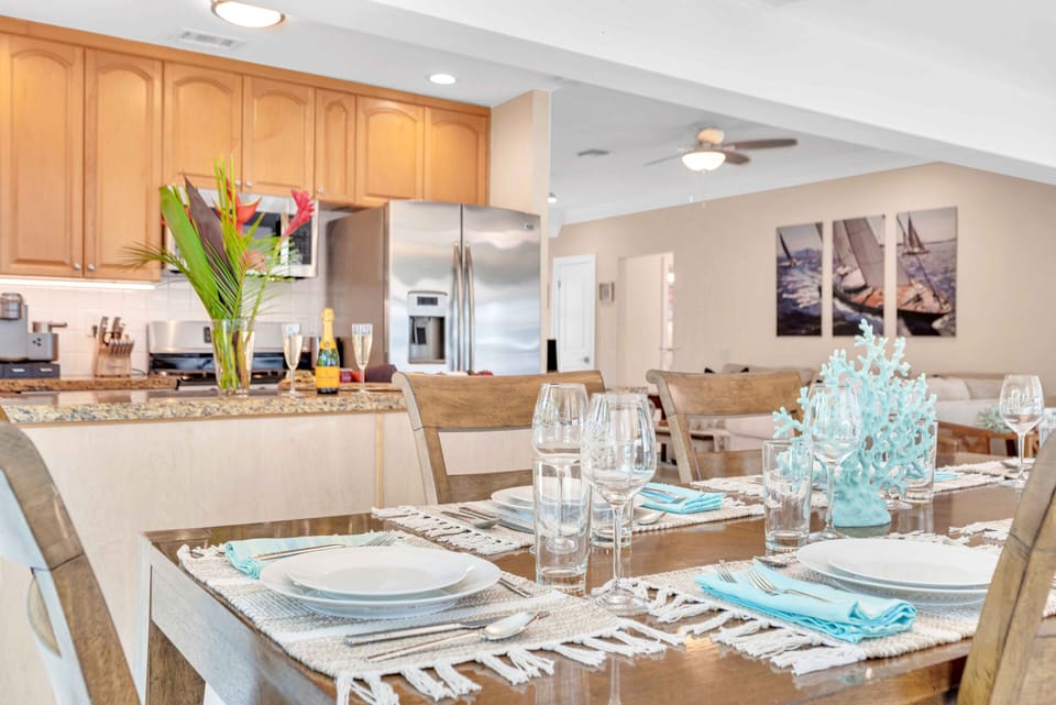The kitchen / indoor dining room has a view of the pool and the waterfront.