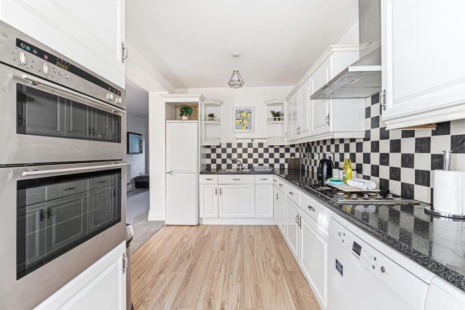 Enjoy a fully equipped kitchen with everything you need for a comfortable stay, including a fridge-freezer, oven, hob, microwave, dishwasher, kettle, toaster, and complete cookware and dining essentials.
