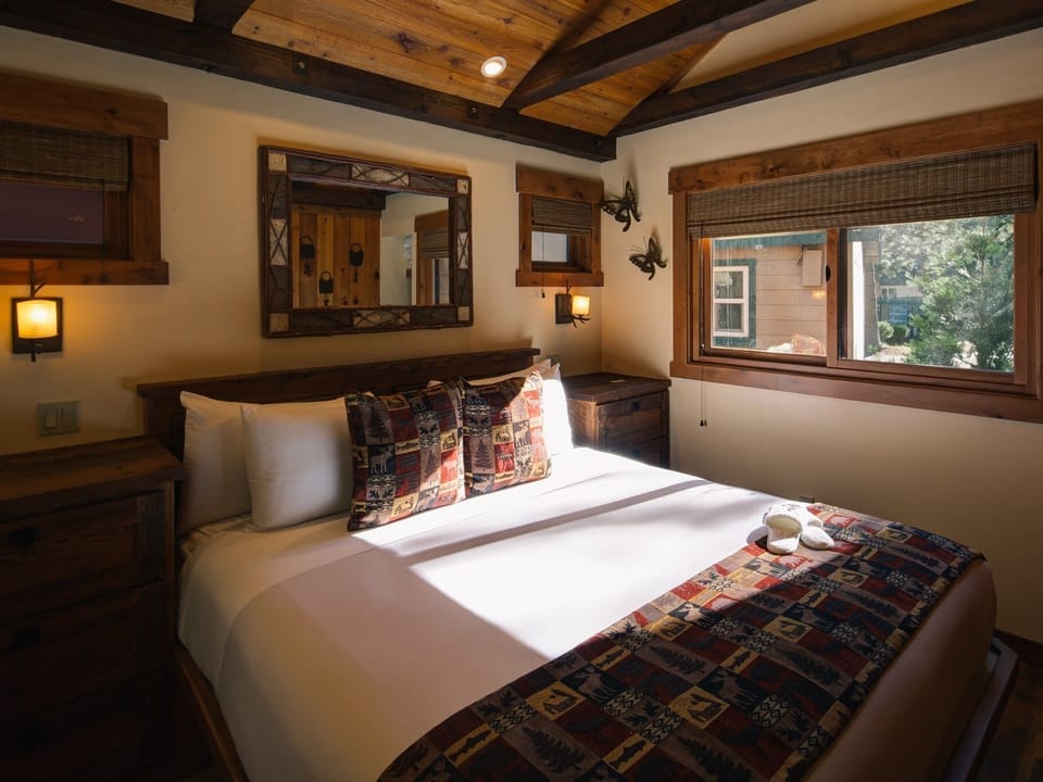 Bedroom: vaulted ceiling, Eastern king bed, custom made cabinets and TV.