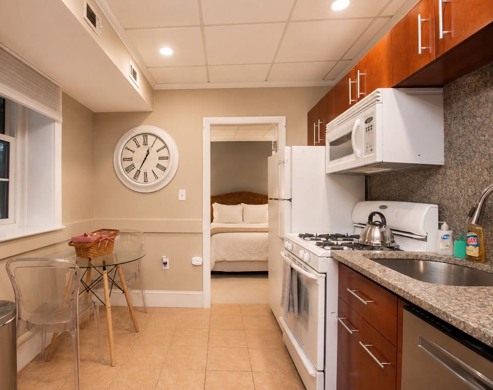 Modern kitchen with granite counters, warm wood cabinets