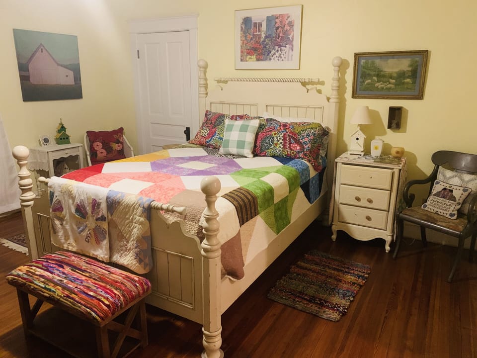 Light filled colorful antique Boho style, queen bed