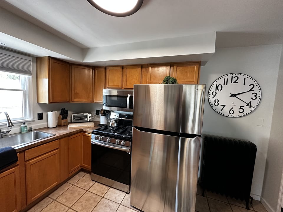 Well stocked kitchen with brand new appliances and sink 
