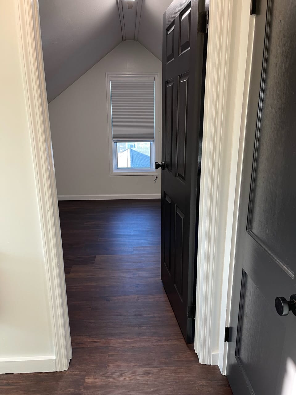 Looking into queen bedroom with blackout blinds 