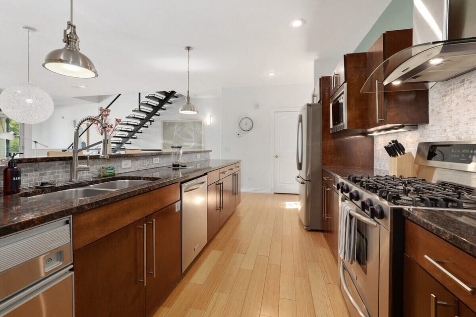 Walk up the stairs and you'll find yourself in our open-concept kitchen and living space.