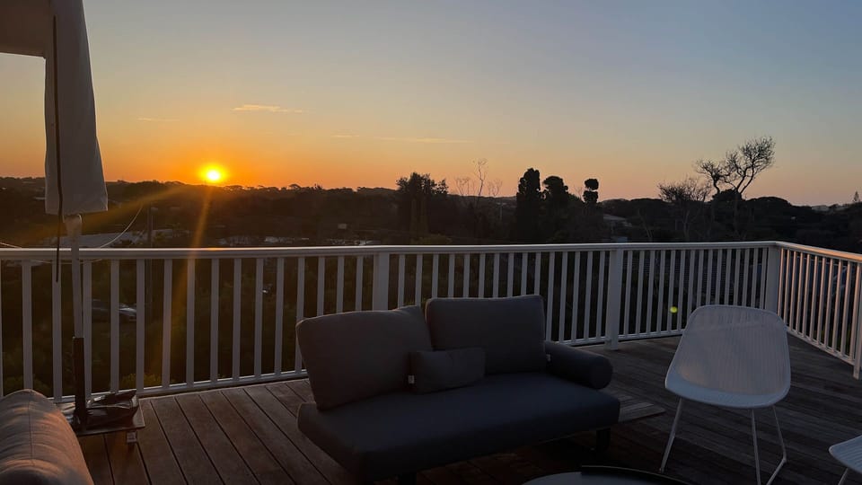 Large sundrenched deck offers a spectacular 270 degree view over the treetops towards the back beach dunes.