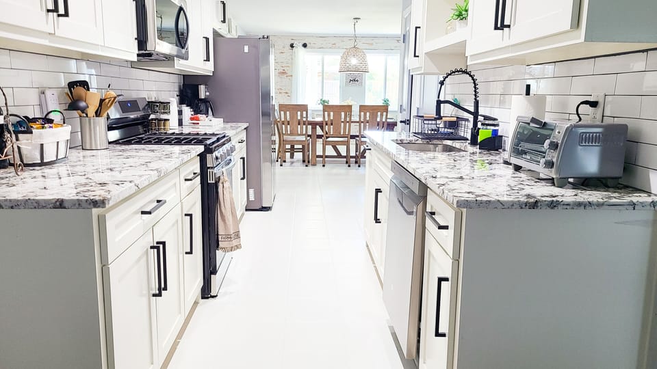 Galley kitchen. Fully stocked with pots and utensils.