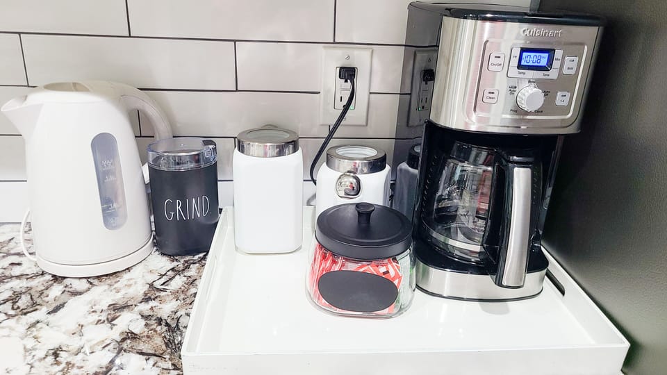 Coffee station with cream, sweeteners, regular coffee and bean coffee, grinder