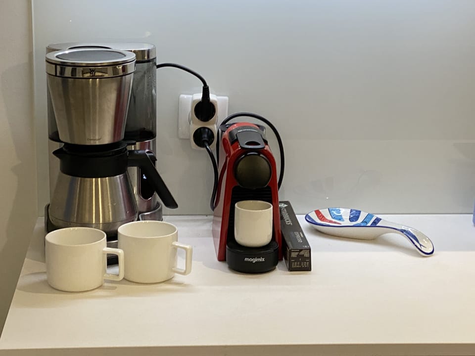 Coffee machine, Nespresso, tea kettle and french press. 