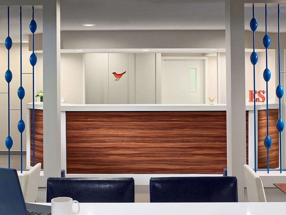 Check in smoothly at the modern front desk before relaxing.