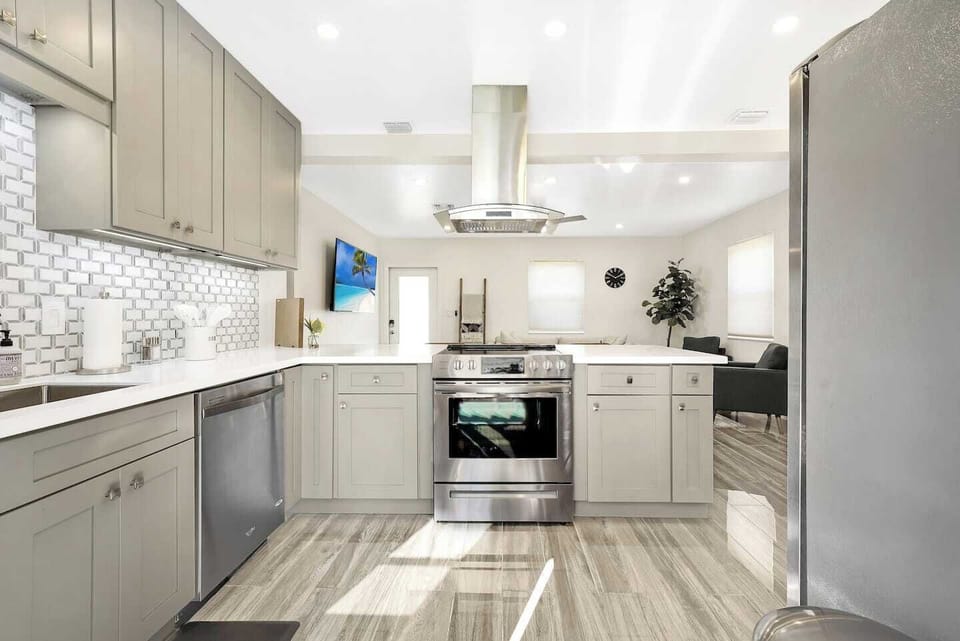 Newly built kitchen with kitchen essentials. Refrigerator, stove, dish washer etc. 